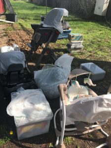 baby furniture on the lawn for disposal after toxic mold exposure