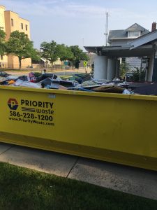 a dumpster full of one family's contents exposed to toxic mold