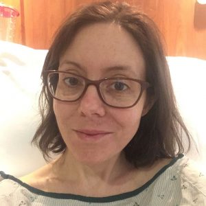 very thin woman in hospital bed fighting ulcerative colitis