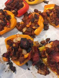 cooked pizza peppers on a piece of parchment paper after removing from the oven