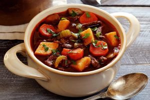 thick, warm, beef stew in a handmade bowl