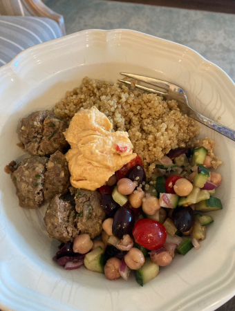 Dairy Free Greek Salad served with greek meatballs, quinoa, and red pepper hummus